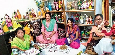 The women with the toys made by them which have changed their lives