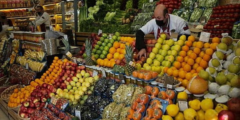A man works at a food shop, in Ankara, Turkey. (Photo | AP)
