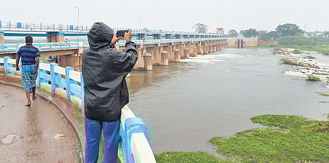 Following the rainfall, water flows out from the Viraganur check dam in Madurai district on Wednesday | kk sundar