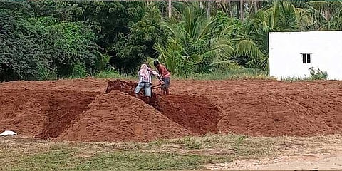 File picture of workers drying coconut husk in Pollachi