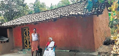 A displaced family outside their mud house at Bandhabhui in Bonai. (Photo | Express)