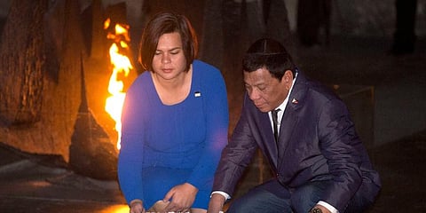 Philippine President and his daughter lay a wreath during a memorial ceremony at the Yad Vashem Holocaust Memorial in Jerusalem. (Photo | AP)