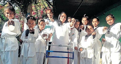 Rai with the girls she has motivated to become Taekwondo players.