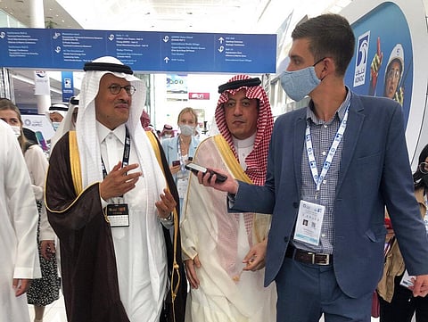 Saudi Energy Minister Prince Abdulaziz bin Salman, left, speaks to journalists at the Abu Dhabi International Petroleum Exhibition and Conference, in Abu Dhabi, UAE, Monday Nov. 15, 2021. (Photo | AP)