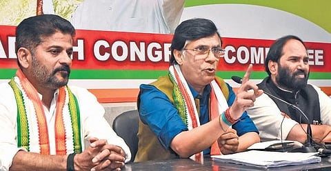 AICC national spokesperson Pawan Khera speaks to the media at Gandhi Bhavan on Tuesday. Also seen are TPCC president A Revanth Reddy and Nalgonda MP  N Uttam Kumar Reddy. (Photo | EPS, R V K Rao)