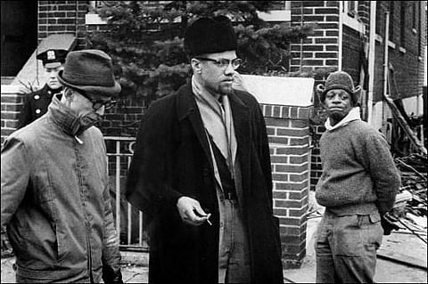 Undated picture of Malcolm X (C), the leader of the Organization for the Afro-American unity. (File photo | AFP)