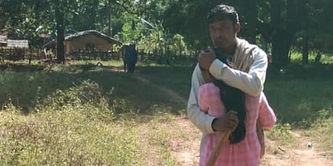 PMSGY engineer Ajay Roshan Lakra hugs his wife after he was set free by Maoists in a jan-adalat. (Photo | EPS)