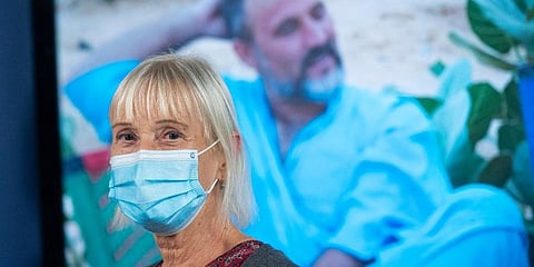 Els Woodke stands in front of a video monitor which displays a photo of her husband Jeff Woodke, who is the victim of a 2016 kidnapping by a jihadist terrorist group in West Africa. (Photo | AP)