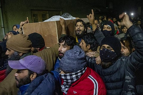 Relatives and neighbours shout slogans as they carry coffin containing body of Mohammad Altaf Bhat, a shopping center owner who was among four people killed in a deadly raid. (Photo | AP)