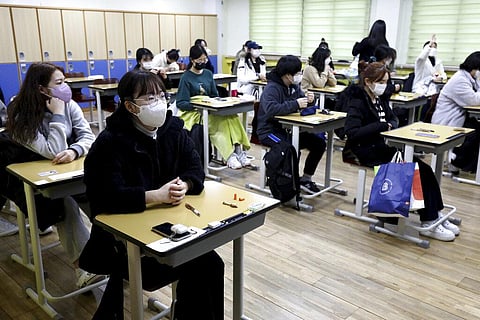 South Korean students wait for the start of the College Scholastic Ability Test at a high school in Seoul Thursday, Nov. 18, 2021. (Photo | AP)