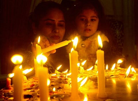 Sikh devotees light candles at a gurudwara on the occasion of birth anniversary of Guru Nanak, in Gurugram. (Photo | PTI)