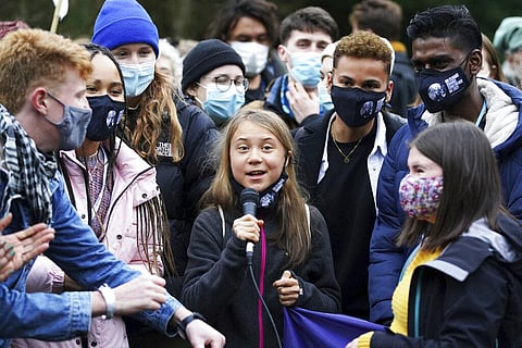 Swedish climate activist Greta Thunberg, centre, speaks alongside fellow climate activists during a demonstration at Festival Park, in Glasgow. (Photo | AP)
