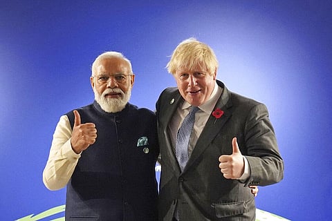 Britain's Prime Minister Boris Johnson greets India's Prime Minister Narendra Modi, left, ahead of their bilateral meeting. (Photo | AP)