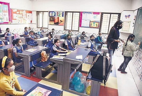 A girl draws on a board in a on Monday as schools reopen in New Delhi after months due to the Covid-19 pandemic. (Photo | Parveen Negi, EPS)