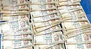 Demonetised banknotes recovered from the Assistant executive engineer of Ranpur Rural Development division Rusinath Baral.