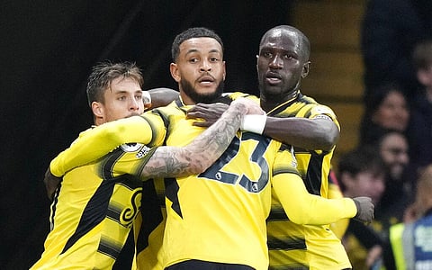 Watford's Joshua King celebrates with teammates after scoring goal during match against Manchester United at Vicarage Road, Watford, England, Saturday. (Photo | AP)