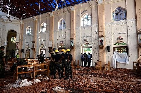 Security personnel inspect the interior of St Sebastian's Church in Negombo after the church was hit in series of bomb blasts targeting churches in Sri Lanka (Photo | AFP)