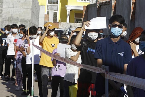 Young people line up for receiving shot of the Sinovac's COVID-19 vaccine at the Phnom Penh Thmey Health Center, during a campaign in Phnom Penh, Cambodia (Photo | AP)