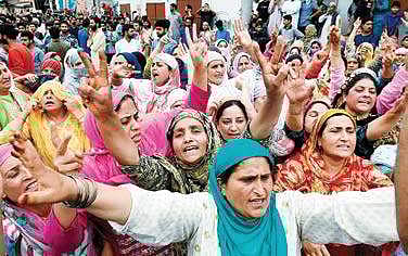 Women shouting slogans during funeral prayers for one of the militants killed in the overnight encounter with security forces in Budgam district, at Hyderpora in Srinagar on Wednesday| PTI