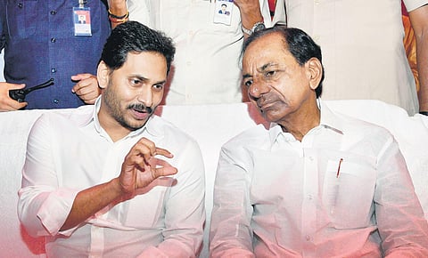 AP Chief Minister YS Jagan Mohan Reddy with his Telangana counterpart  K Chandrasekhar Rao at a function in Shamshabad on Sunday I Express