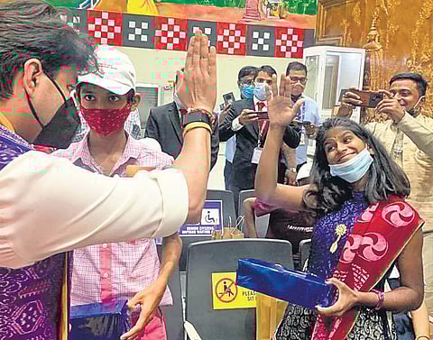 Union Minister Jyotiraditya Scindia meets a girl orphaned by Covid-19 during the Udan Utsav at Veer Surendra Sai airport in Jharsuguda. (Photo | Express)