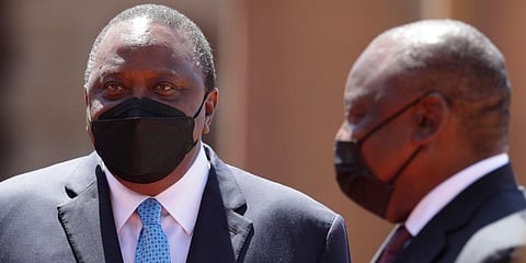 Kenyan President, Uhuru Kenyatta (L) and his South Africa counterpart Cyril Ramaphosa attend a welcoming ceremony in Pretoria, South Africa. (Photo | AP)