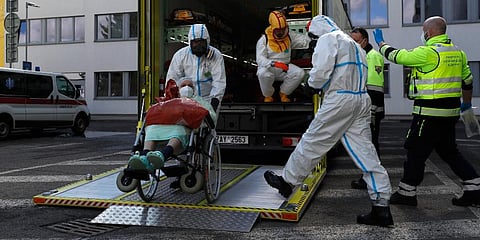 Health care workers transport a COVID-19 patient, in Ceska Lipa, Czech Republic. (Photo | AP)