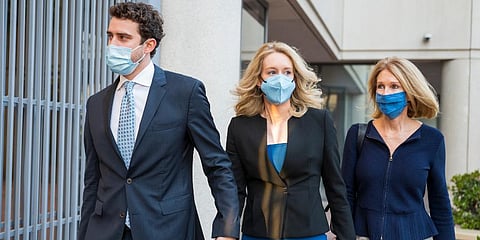 Elizabeth Holmes (C) walks into federal court in San Jose, Calif. (Photo | AP)