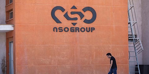 FILE - A logo adorns a wall on a branch of the Israeli NSO Group company, near the southern Israeli town of Sapir, Aug. 24, 2021. (Photo | AP)