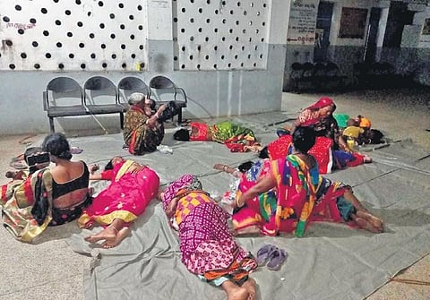 Women sleeping on the floor of Aul CHC after sterilisation operation, Nov 22, 2021. (Photo | Express)