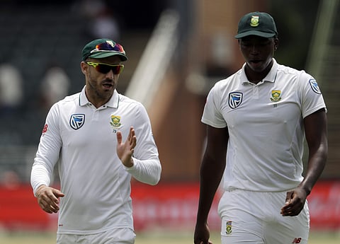 South Africa's captain Faf du Plessis‚ left, has a word with bowler Lungi Ngidi (Photo| AP)