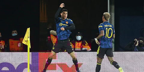 Manchester United's Cristiano Ronaldo (L) celebrates after scoring the opening goal during a Champions League match against Villarreal at the Ceramica stadium. (Photo| AP)