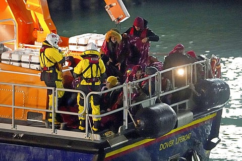 A group of people thought to be migrants are brought in to Dover, England by the RNLI, following a small boat incident in the English Channel (Photo | AP)