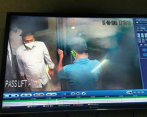 An image from the CCTV footage where a cop in plain clothes is seen barging into the house in Chennai | Express