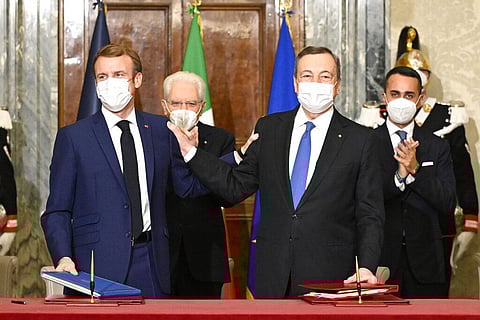 France's President Emmanuel Macron, left, and Italy's Prime Minister Mario Draghi sign the Franco-Italian Quirinal Treaty (Photo | AP)