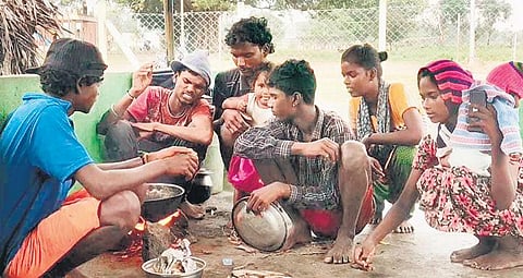 Irular tribals preparing their meals at the waste segregation centre | Express