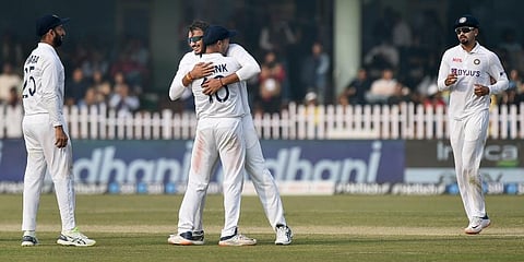 Indian bowler Axar Patel celebrates a wicket with teammates during third day of the first Test agaisnt New Zealand, at Green Park stadium in Kanpur, Saturday, Nov. 27, 2021. (Photo | PTI )