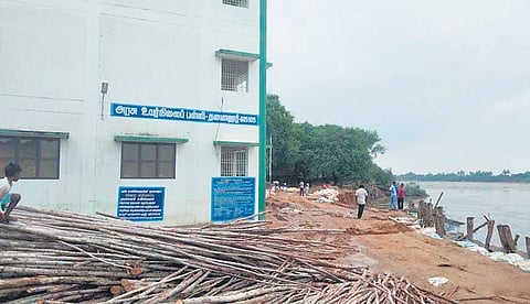 Water eroded the banks of Thenpennai river up to 50 meters into Thalavanur village near a govt higher secondary school in Villupuram on Friday | Express xpressxpress