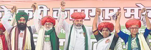 Farmer leaders Tejinder Singh (L), Darshan Pal (2L), Rakesh Tikait (C) and social activist Medha Patkar (R) gesture during a Kisan Mahapanchayat in Mumbai on Sunday. (Photo | PTI)