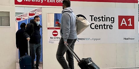 Passengers get a COVID-19 test at a Testing Centre at Heathrow Airport in London. (Photo | AP)