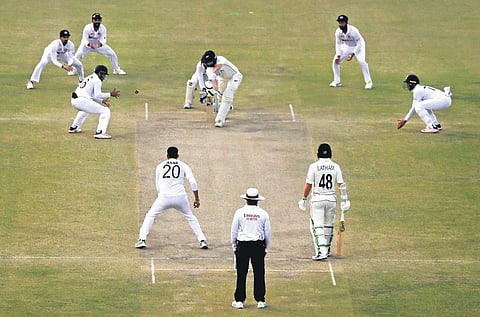 India’s Axar Patel bowls to New Zealand’s William Somerville on Day 4 of their first Test in Kanpur on Sunday | AP