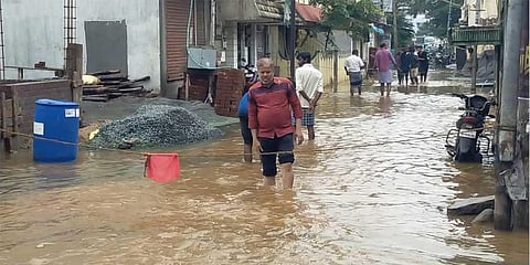 Surplus water from major lakes flowed into residential areas in Tiruchy on Sunday. (Photo | EPS)