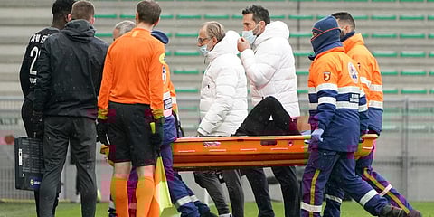 PSG's Neymar is carried off the pitch by medical staff on a stretcher after an injury during a French League One match against Saint-Etienne. (Photo| AP)
