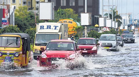 Vehicles on the flooded OMR near Semmancheri on Sunday. (Photo| EPS)
