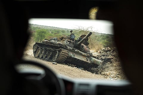 A destroyed tank is seen by the side of the road south of Humera in western Tigray, then annexed by the Amhara region, in Ethiopia. (Photo | AP)