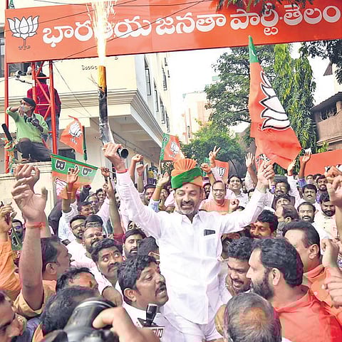After Eatala Rajender’s victory in Huzurabad bypoll, BJP State president Bandi Sanjay celebrates with party workers in Hyderabad on Tuesday | VINAY MADAPU