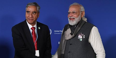 PM Narendra Modi (R) interacts with Nepal PM Sher Bahadur Deuba (Photo | Arindam Bagchi Twitter)