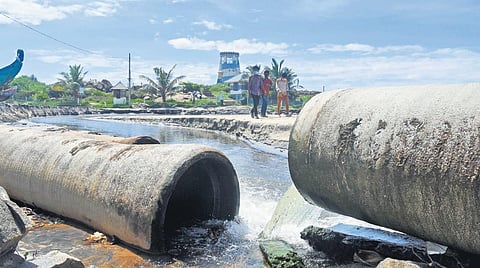 The broken sewer line discharging waste into the Light House Beach. The pipes laid underneath were damaged by severe sea erosion | B P Deepu