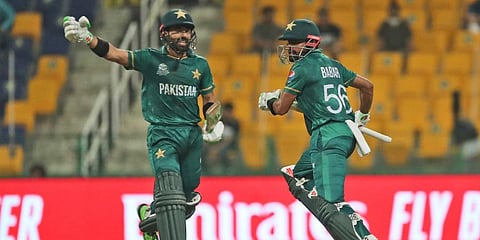 Pakistan's captain Babar Azam and Mohammad Rizwan run between wickets against Namibia. (Photo | AP)