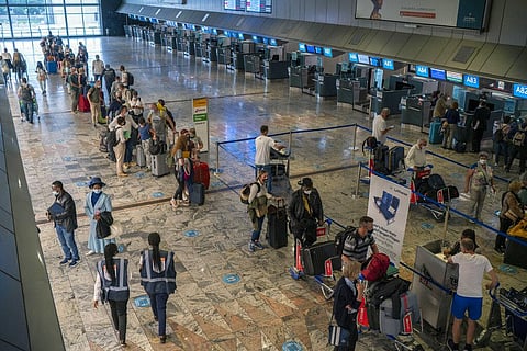 Passengers check in at the Lufthansa counter at Johannesburg's OR Tambo's airport, Monday Nov. 29, 2021. (Photo | AP)